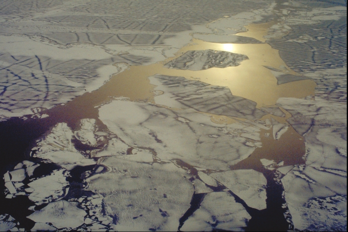 After the minimum, a new freeze cycle begins: early October sea ice forming near Kotzebue, Alaska. Image courtesy of Larry Hamilton.