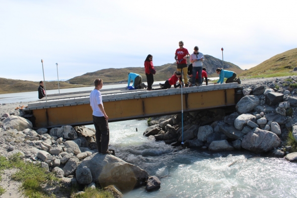 Collecting data for stream discharge (Photo Credit: Lynn Reed)